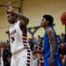 Milan player Nick Perkins celebrates a three-point shot as a timeout is called in the second half of the game against Gibraltar Carlson on Monday, March 11. Daniel Brenner I AnnArbor.com